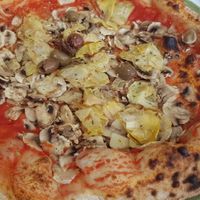 Pizza with mushrooms customized removing cheese and adding artichokes. at Pizzeria To je To in Istarska županija