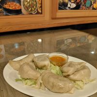 Vegetable momos (with cabbage filling) and a spicy indian sauce at Rikša - Curry & Wok in Ljubljana