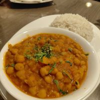 Chole kulche (creamy indian dish with chickpeas) and rice at Rikša - Curry & Wok in Ljubljana