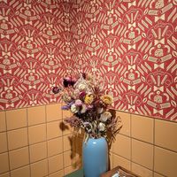 pasta wallpaper and free tampons in bathroom at Adelleda in Portland