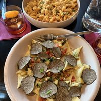 Hand shaved truffles over zucchini stuffed panzotti… spicy fusilli in the background   at Adelleda in Portland