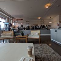 One side of the cafe, facing the order station. Coffee bar (free refills!) is to the right, lots more seating, games, books, and coloring behind me and to the right. at Maydan Cafe in Baldwinsville