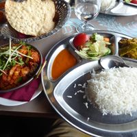 Overall plating with rice, sides and bread at Ravintola Mayur in Uusimaa