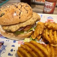 Carolina Tindle Chicken burger with waffle fries   at BrewDog in Horley