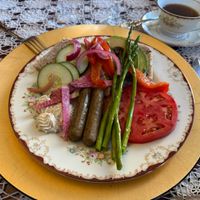 Vegan breakfast with fresh baked bread, homemade vegan cashew spread, roasted veggies, and vegan sausage. (Not pictured: fresh squeezed juice and vegan chocolate chip oat cookie) at Buffalo Harmony House in New York