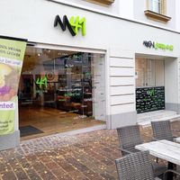 Store front with outdoor seating at Main41 in Sachsen