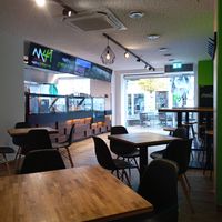 Vegan options promoted on screen & indoor seating at Main41 in Sachsen
