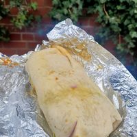 Aloo Tikki Wrap with Chickpeas at Deluxe Snacks in Rugby