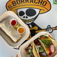 Shorty burrito and array of nachos at El Borracho - Pike Place Market in Seattle