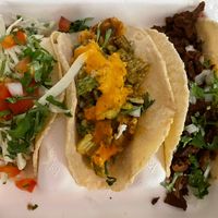 Left to right: shrymo tajín taco, spicy chipotle potato taco, barbacoa taco  at El Borracho - Pike Place Market in Seattle