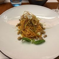 Tagliolini with roasted tomato cream with smoked seitan tartare and fried leek  at MADREPERLA Bistrot in Friuli-venezia Giulia