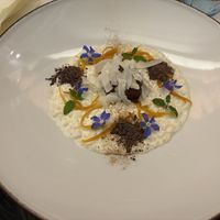 Rice cream with chocolate ice cream
with coconut flakes and orange zest  at MADREPERLA Bistrot in Friuli-venezia Giulia