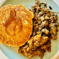 Pancakes, savory breakfast potatoes, tofu scramble. 🤌✨  at Mac & yease  in Los Angeles