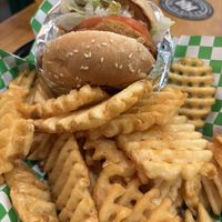 Vegan chicken burger with HUGE side of waffle friess  at Soy Boys in Toronto