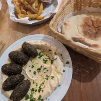 Hummus plate + falafel, pita and side of french fries at Sababa Restaurant in Sololá