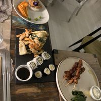 Stir fry tofu with peanut butter, tempura vegetables and sushi, and soy chunks in tamari sauce  at Moon in Siracusa