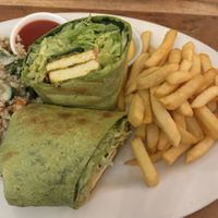 Tandoori wrap with chips and salad  at Radhey Chai Bar in Fitzroy