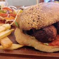 Kofta burger with chips and salad  at Radhey Chai Bar in Fitzroy