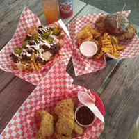Buttamilk chik'n tenders, loaded fries, and buttamilk chik'n sandwich at Atlas Meat-Free Delicatessen in Miami
