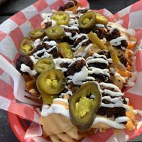 Loaded burnt end fries at Atlas Meat-Free Delicatessen in Miami