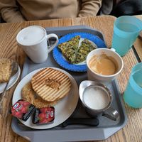 Vegan Apple crumble, oat milk coffee and bagel with Jam. at Au Grain de Café in Montreal