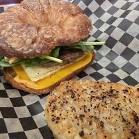 Breakfast sandwich with a croissant at The Dusted Cup in Portland