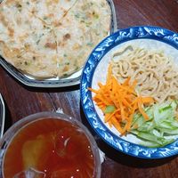 Sesame sauce noodles and onion pancake at Baansuan Sudawan in Bangkok
