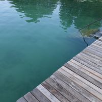 Lake Klopein and its pier at Loving Hut Pension in St Kanzian