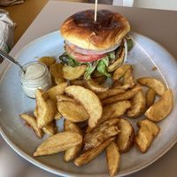 Vegan burger with chickpea patty and potato wedges  at Café Melita - Palmelita in Tenerife