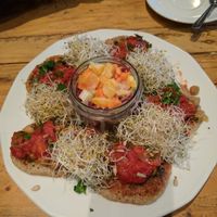 Buckwheat pancakes with orange salsa and sprouted greens at Vege Miasto in Warsaw