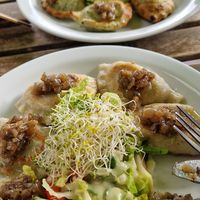 Mushroom pierogi and think spinach. at Vege Miasto in Warsaw