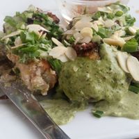 Cudaki-stuffed potatoes with sauce at Vege Miasto in Warsaw