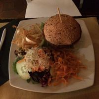 vegan burger with veggie chips and salad at DosTrece in Barcelona