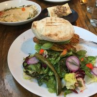BLTA Sandwich with Flatbread and Hummus in the background. at Mesa Verde in Santa Barbara