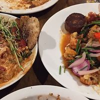 Amazing vegan cashew lasagne to the left with zaatar flatbread / more ordinary harissa cauliflower to the right  at Mesa Verde in Santa Barbara