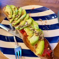 Vegan toast with tomatoes, garlic, avocado, olive oil and seeds at Panadería Morales, S.L. in Pontevedra