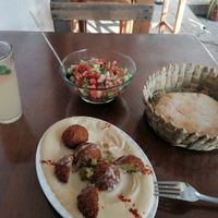 Hummus with falafel, bread and Arabic salad at Kufiyyeh Arabic Restaurant in Yucatán