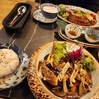 Silken tofu with mushrooms and carrot, vegan duck with teriyaki-orange sauce and vegetables at Ananda Vegan Indochine Tapas & Sushi Bar in Regensburg