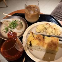 Steamed vegetable dumplings, focaccia and grilled cauliflower with iced tea and oat milk latte   at HKG - Cathay Pacific The Pier Business Lounge - 國泰航空 「玉衡堂」商務貴賓室 in New Territories