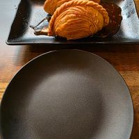 The Vegan Curry Puffs and our plates.  at CoCoCurry - Thai Curry Cafe in San Diego