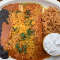 Vegan faux chicken enchiladas with non dairy cheese and sour cream at El Chupacabra - West in Seattle
