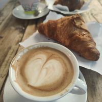 Soy cappuccino and apricot jam croissant at Caffe Trastevere in Rome