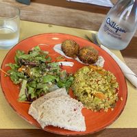 veggie rice with lentils and a tofu cutlet served with a green salad  at InFusion in Genoa