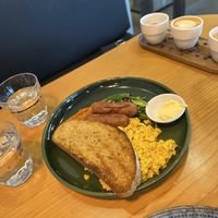 Tofu scramble, toast, and vegan sausage.   at Avodi Vegetarian & Cafe in Auckland