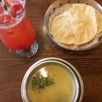 Dal soup / raspberry juice with lime at Tharavadu in Leeds