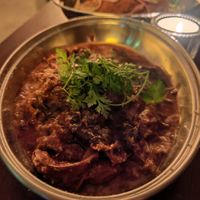 Shredded beef in red wine, confit fillet, shallots, gondino and chervil, my favorite dish, with an amazing texture and taste. We finished the plate with the delicious sauce! at Présent in Paris
