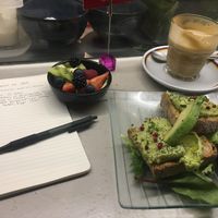 avocado toast, fruit, and an almond milk caffe latte (best milk there) at Ditta Artigianale in Florence