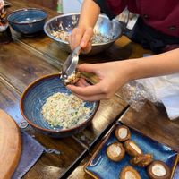 Stuffing mushrooms with tofu filling at Rose Kitchen in Hà Nội