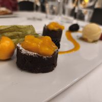 Dessert on night one (my coworkers were jealous 🤠) mini brownies with Mango compote. at Restaurant Tausend93 Im Seehotel Maria Laach in Rheinland-pfalz