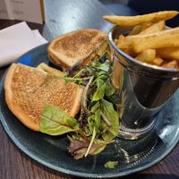 Cheese, pesto and tomato toastie, made VG (third toastie hiding behind the fries, decent portion) at Voco Reading by IHG in Berkshire